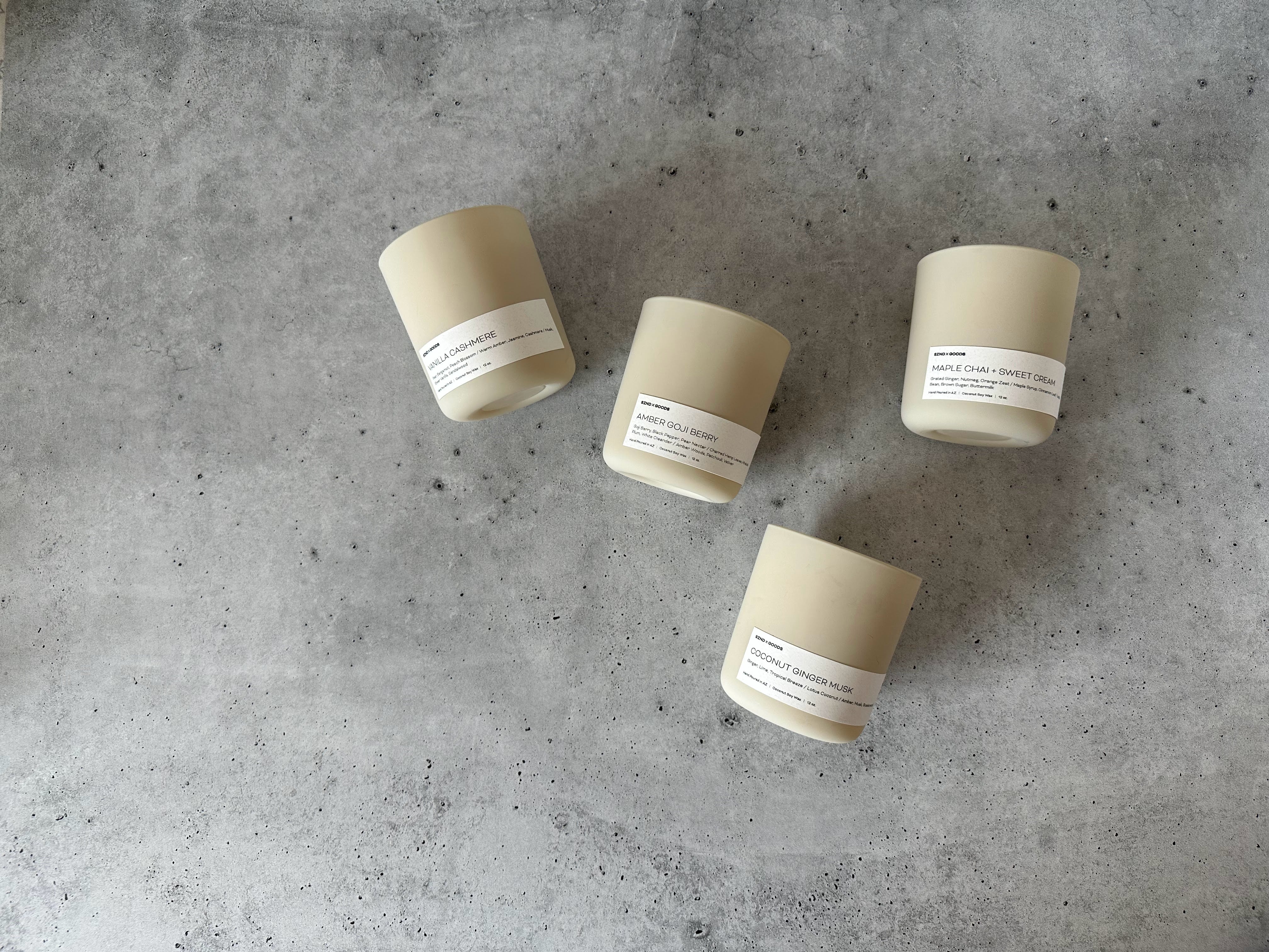 The Signature collection wooden wick candles consisting of amber goji berry, vanilla cashmere, and maple chai and sweet cream.