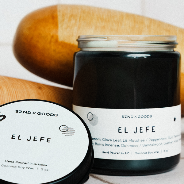Black candle jar labeled 'El Jefe' with an 8oz and 2oz wooden wick candle.