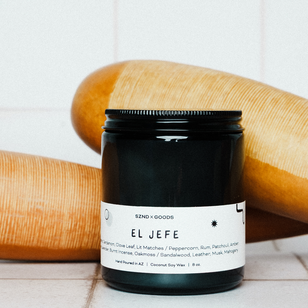 Black candle jar with 'El Jefe' label on a white background