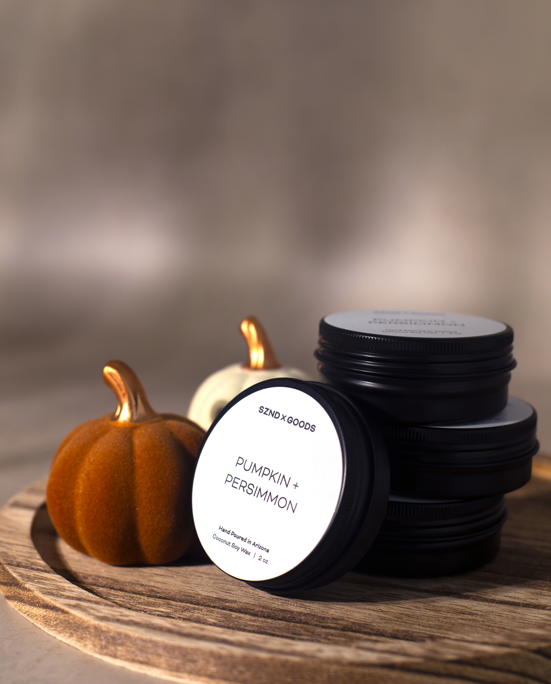 A mini Pumpkin + Persimmon candle in a 2oz jar.