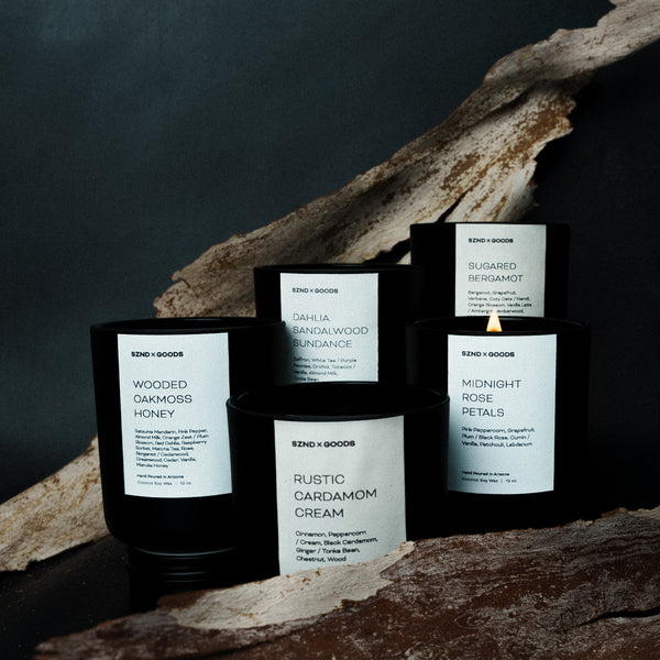 Collection of candles unisex wooden wick candles on a dark background.