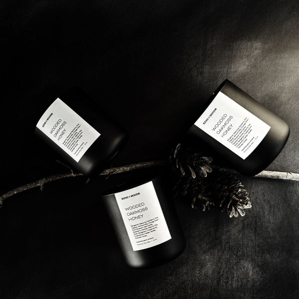 Group of three of the 12oz wooden wick candles in the scent Wooded Oakmoss Honey.