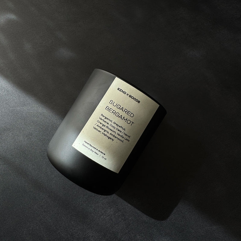 Sugared Bergamot candle on a black background.