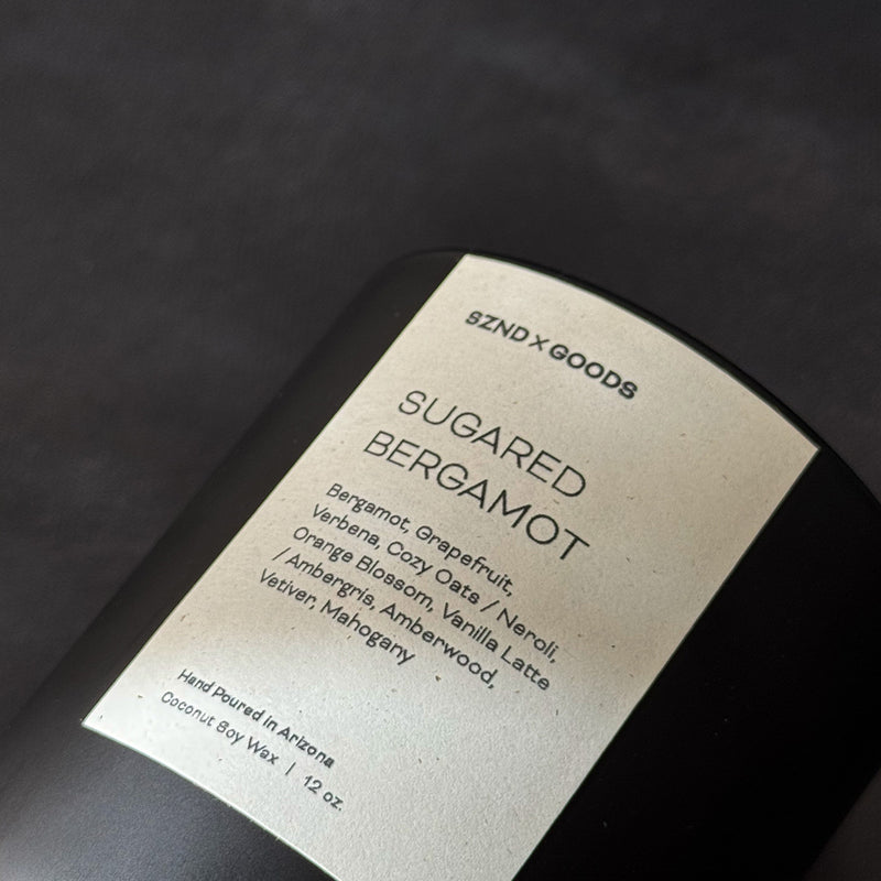 Sugared Bergamot wooden wick candle on black background.