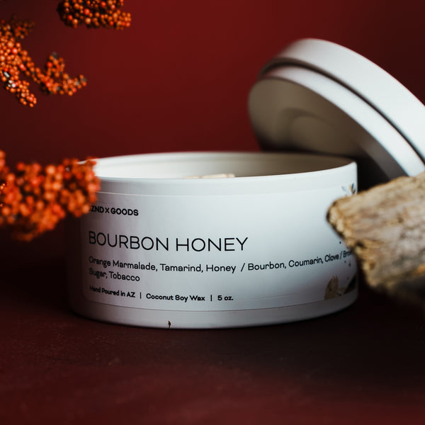 Jar of bourbon honey with a red background